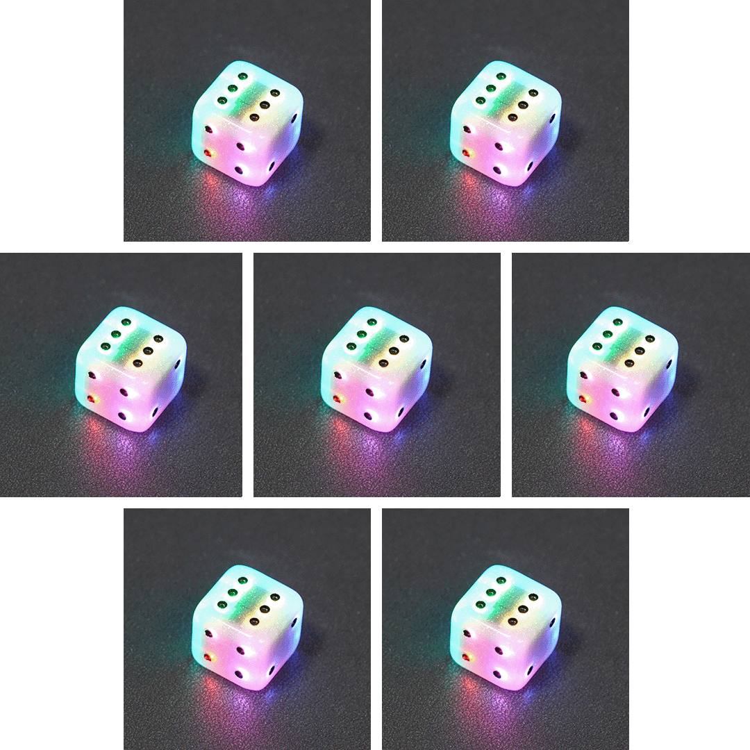 Collage of 7 lit Aurora Sky Pipped D6 with a rainbow of colors across each face. Aurora Sky colorway is a mostly translucent white resin base packed with small blue and silver glitter throughout. The numbers or symbols are painted metallic black.