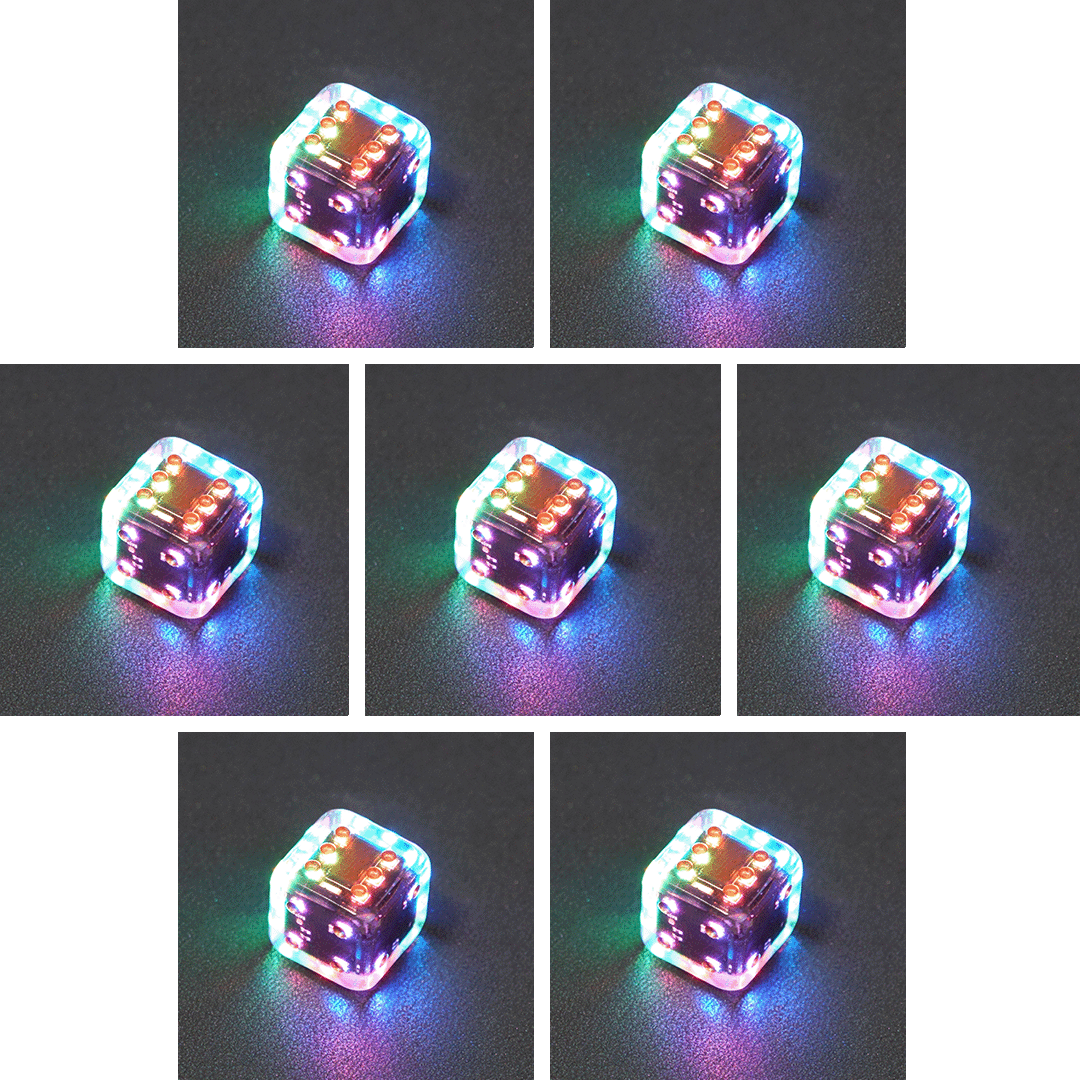 Collage of 7 lit Clear Pipped D6 with a rainbow of colors across each face. Clear colorway is fully transparent resin allowing internal circuit board to be visible. The numbers or symbols are painted metallic copper.