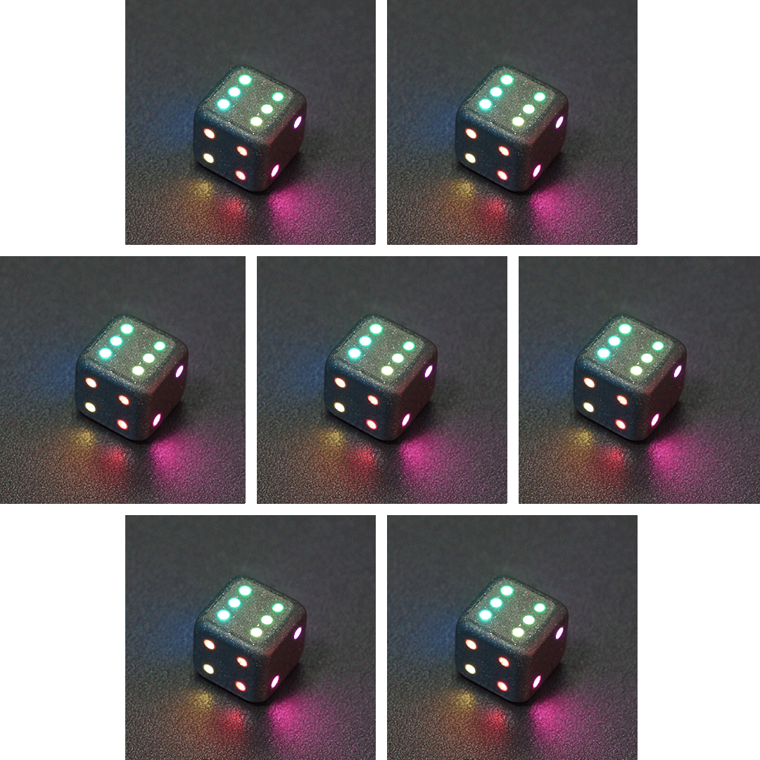 Collage of 7 lit Hematite Grey Pipped D6 with a rainbow of colors across each face. Hematite Grey colorway is a fully opaque medium tone silver resin packed with rainbow glitter of various sizes. The numbers or symbols are painted pale white.