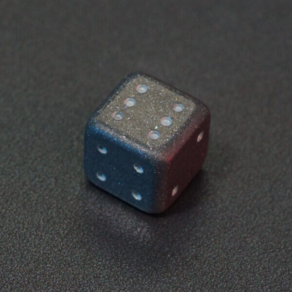 Collage of 7 lit Hematite Grey Pipped D6 with a rainbow of colors across each face. Hematite Grey colorway is a fully opaque medium tone silver resin packed with rainbow glitter of various sizes. The numbers or symbols are painted pale white.