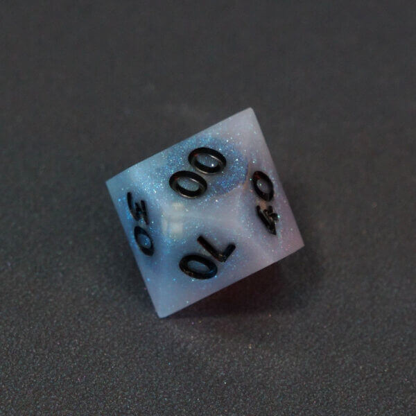 Collage of 7 lit Aurora Sky D00 with a rainbow of colors across each face. Aurora Sky colorway is a mostly translucent white resin base packed with small blue and silver glitter throughout. The numbers or symbols are painted metallic black.