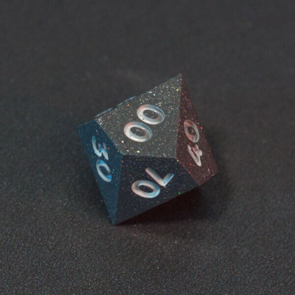 Collage of 7 lit Hematite Grey D00 with a rainbow of colors across each face. Hematite Grey colorway is a fully opaque medium tone silver resin packed with rainbow glitter of various sizes. The numbers or symbols are painted pale white.