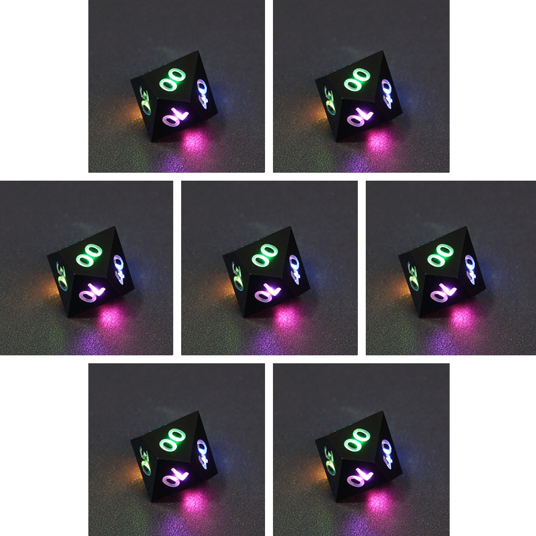 Collage of 7 lit Onyx Black D00 with a rainbow of colors across each face. Onyx Black colorway is a fully opaque black with no glitter, creating an almost matte style. The numbers or symbols are pale white.