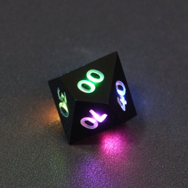 Collage of 7 lit Onyx Black D00 with a rainbow of colors across each face. Onyx Black colorway is a fully opaque black with no glitter, creating an almost matte style. The numbers or symbols are pale white.