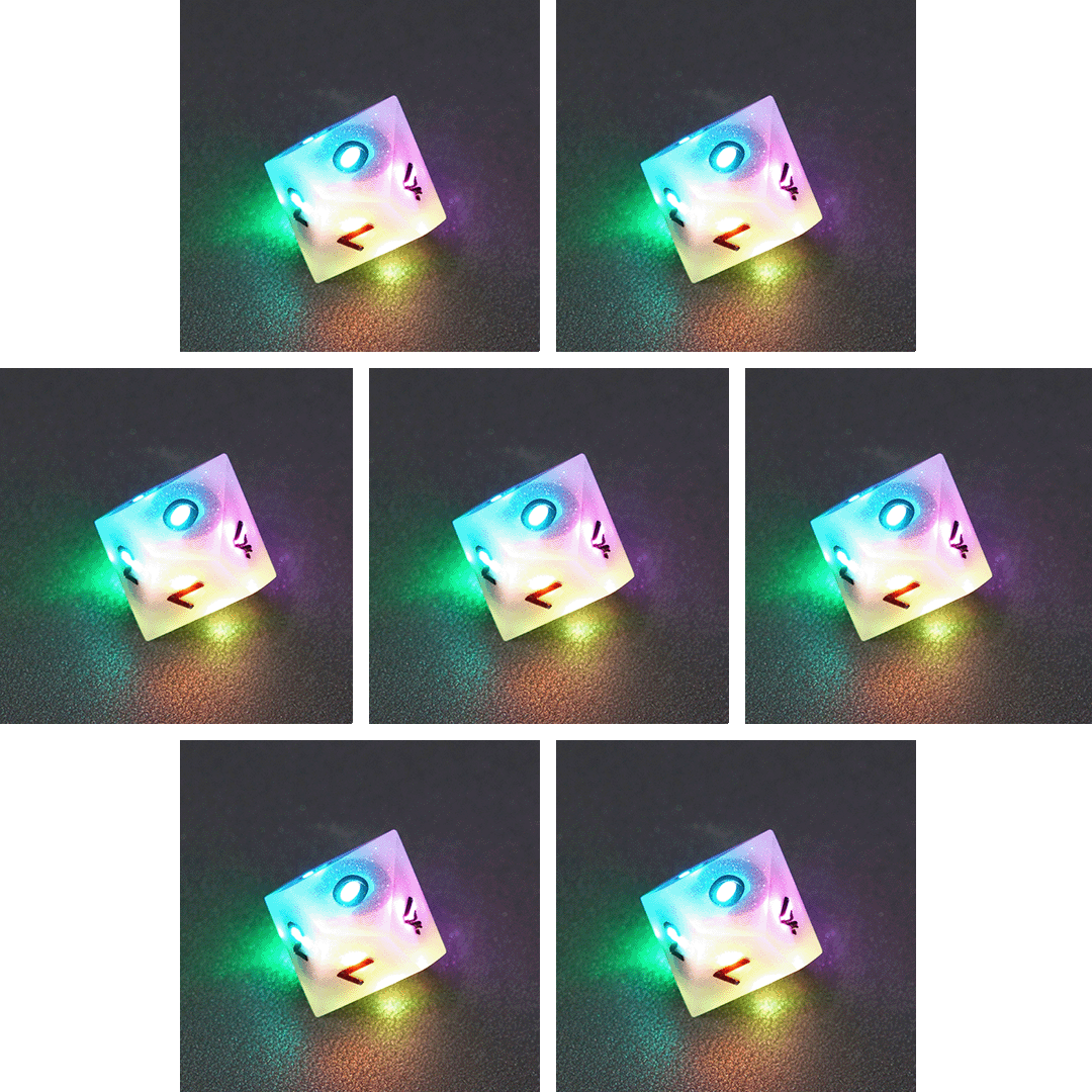 Collage of 7 lit Aurora Sky D10 with a rainbow of colors across each face. Aurora Sky colorway is a mostly translucent white resin base packed with small blue and silver glitter throughout. The numbers or symbols are painted metallic black.