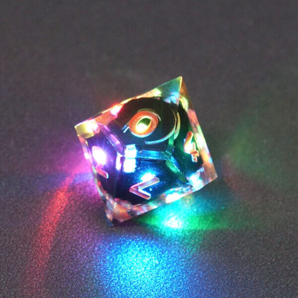 Collage of 7 lit Clear D10 with a rainbow of colors across each face. Clear colorway is fully transparent resin allowing internal circuit board to be visible. The numbers or symbols are painted metallic copper.
