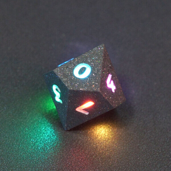 Collage of 7 lit Hematite Grey D10 with a rainbow of colors across each face. Hematite Grey colorway is a fully opaque medium tone silver resin packed with rainbow glitter of various sizes. The numbers or symbols are painted pale white.
