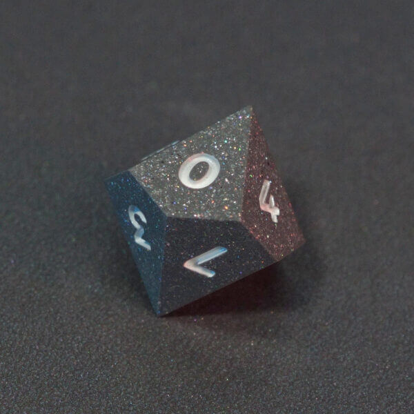 Collage of 7 lit Hematite Grey D10 with a rainbow of colors across each face. Hematite Grey colorway is a fully opaque medium tone silver resin packed with rainbow glitter of various sizes. The numbers or symbols are painted pale white.