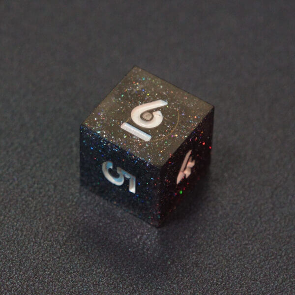 Collage of 7 lit Midnight Galaxy D6 with a rainbow of colors across each face. Midnight Galaxy colorway is a mostly translucent dark smoke black resin base packed with rainbow glitter of various sizes. The numbers or symbols are painted pearl white.