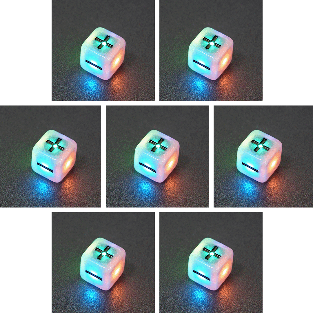 Collage of 7 lit Aurora Sky Fudge D6 with a rainbow of colors across each face. Aurora Sky colorway is a mostly translucent white resin base packed with small blue and silver glitter throughout. The numbers or symbols are painted metallic black.