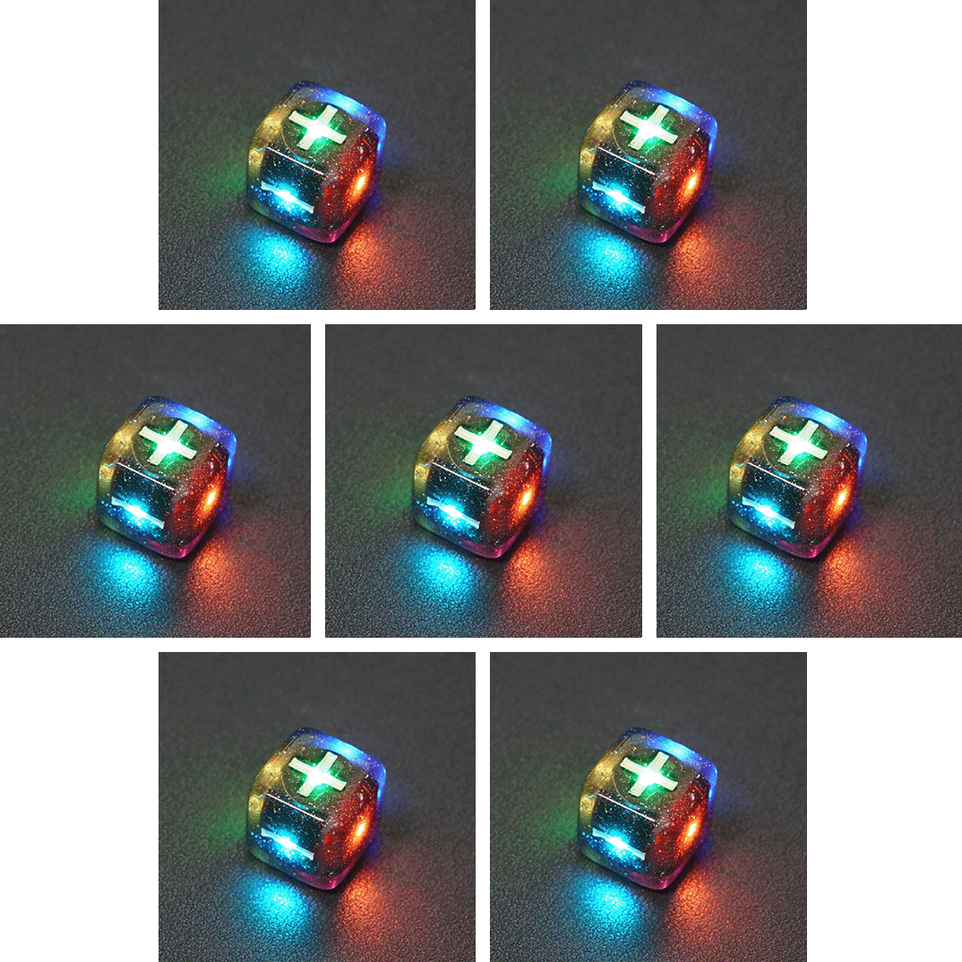 Collage of 7 lit Midnight Galaxy Fudge D6 with a rainbow of colors across each face. Midnight Galaxy colorway is a mostly translucent dark smoke black resin base packed with rainbow glitter of various sizes. The numbers or symbols are painted pearl white.