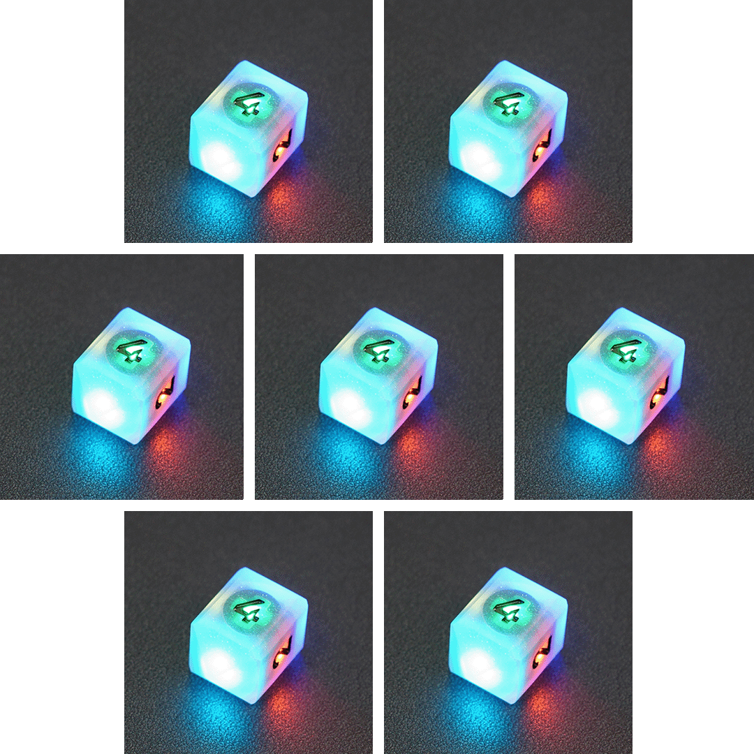Collage of 7 lit Aurora Sky D4 in a crystal shape with a rainbow of colors across each face. Aurora Sky colorway is a mostly translucent white resin base packed with small blue and silver glitter throughout. The numbers or symbols are painted metallic black.