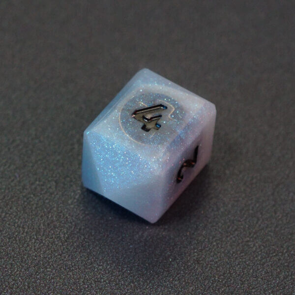 Collage of 7 lit Aurora Sky D4 in a crystal shape with a rainbow of colors across each face. Aurora Sky colorway is a mostly translucent white resin base packed with small blue and silver glitter throughout. The numbers or symbols are painted metallic black.
