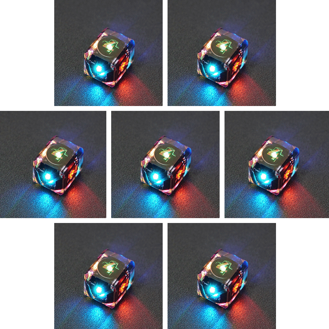 Collage of 7 lit Clear D4 in a crystal shape with a rainbow of colors across each face. Clear colorway is fully transparent resin allowing internal circuit board to be visible. The numbers or symbols are painted metallic copper.