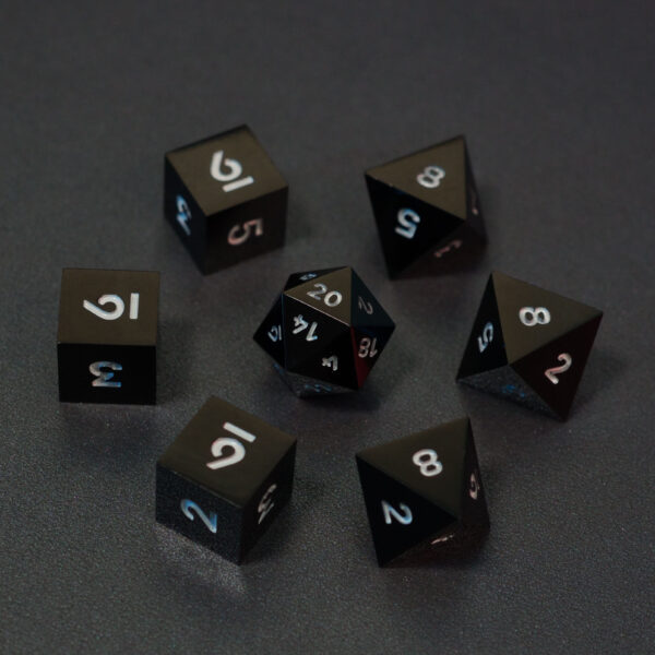 Set of 7 lit Onyx Black dice with a rainbow of colors across all faces. Set Includes: 1 D20, 3 D8, 3 D6. Onyx Black colorway is a fully opaque black resin with no glitter. The numbers or symbols are painted pale white.