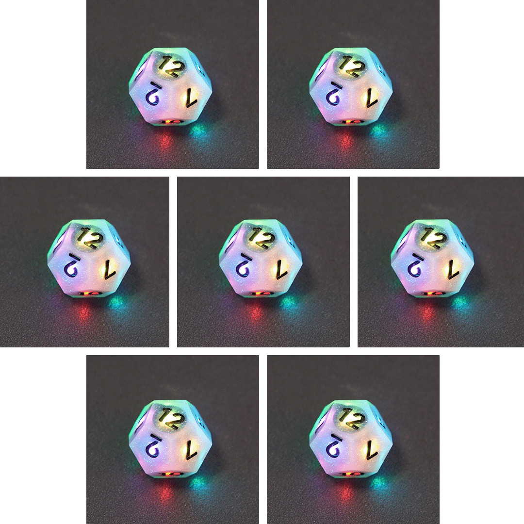 Collage of 7 lit Aurora Sky D12 with a rainbow of colors across each face. Aurora Sky colorway is a mostly translucent white resin base packed with small blue and silver glitter throughout. The numbers or symbols are painted metallic black.