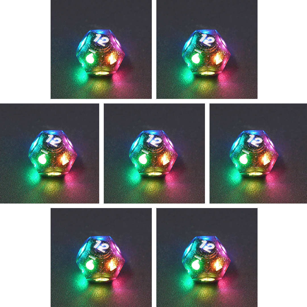 Collage of 7 lit Midnight Galaxy D12 with a rainbow of colors across each face. Midnight Galaxy colorway is a mostly translucent dark smoke black resin base packed with rainbow glitter of various sizes. The numbers or symbols are painted pearl white.