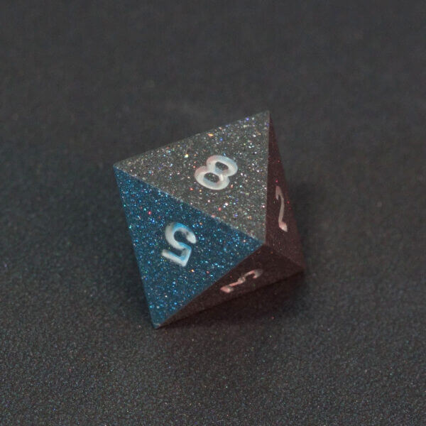 Collage of 7 lit Hematite Grey D8 with a rainbow of colors across each face. Hematite Grey colorway is a fully opaque medium tone silver resin packed with rainbow glitter of various sizes. The numbers or symbols are painted pale white.