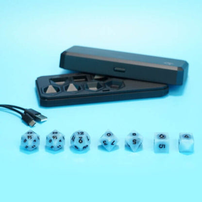 Set of 7 lit Aurora Sky dice with a rainbow of colors across all faces. Set Includes: 2 D20, 1 D12, 1 D10, 1 D8, 1 D6, 1 D4. Aurora Sky colorway is a mostly translucent white resin base packed with small blue and silver glitter throughout. The numbers or symbols are painted metallic black.
