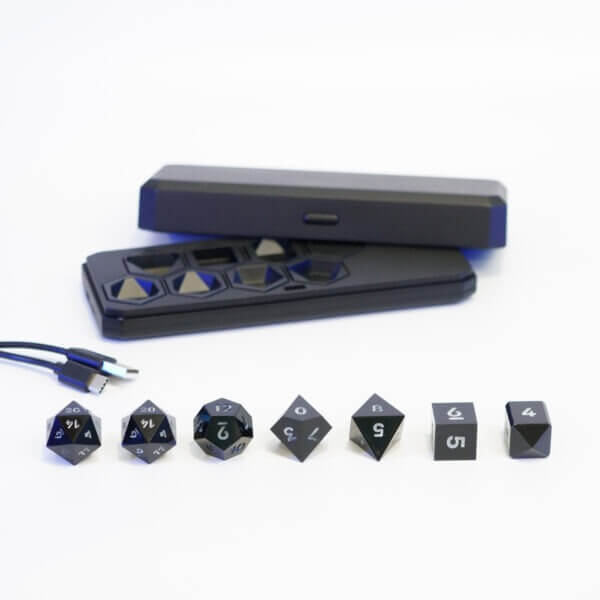 Set of 7 lit Onyx Black dice with a rainbow of colors across all faces. Set Includes: 2 D20, 1 D12, 1 D10, 1 D8, 1 D6, 1 D4. Onyx Black colorway is a fully opaque black resin with no glitter. The numbers or symbols are painted pale white.