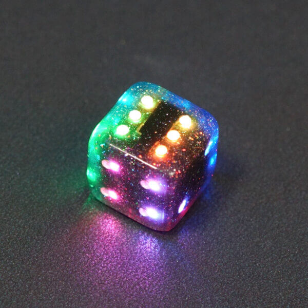 Collage of 7 lit Midnight Galaxy Pipped D6 with a rainbow of colors across each face. Midnight Galaxy colorway is a mostly translucent dark smoke black resin base packed with rainbow glitter of various sizes. The numbers or symbols are painted pearl white.