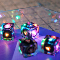 Lit Clear D6s in a clear acrylic dice tray.