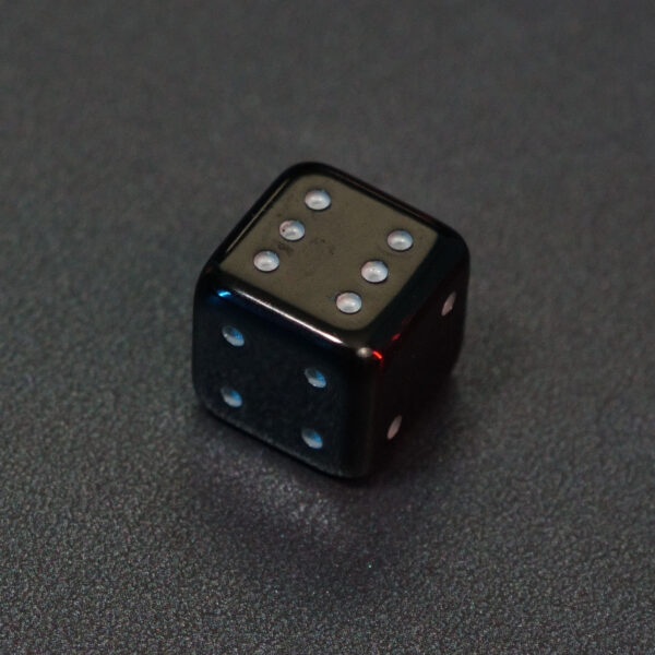 Unlit Onyx Black Pipped D6. Onyx Black colorway is a fully opaque black resin with no glitter. The numbers or symbols are painted pale white.