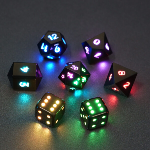 Set of 7 lit Onyx Black dice with a rainbow of colors across all faces. Set Includes: 1 D20, 1 D12, 1 D10, 1 D8, 2 Pipped D6, 1 D4. Onyx Black colorway is a fully opaque black resin with no glitter. The numbers or symbols are painted pale white.