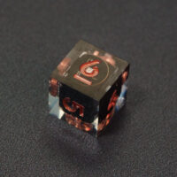 Unlit Clear D6. Clear colorway is fully transparent resin allowing internal circuit board to be visible. The numbers or symbols are painted metallic copper.