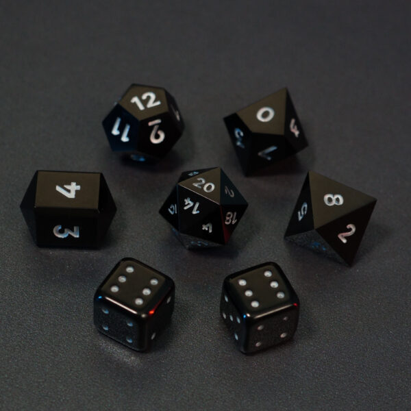 Set of 7 unlit Onyx Black dice. Set Includes: 1 D20, 1 D12, 1 D10, 1 D8, 2 Pipped D6, 1 D4. Onyx Black colorway is a fully opaque black resin with no glitter. The numbers or symbols are painted pale white.