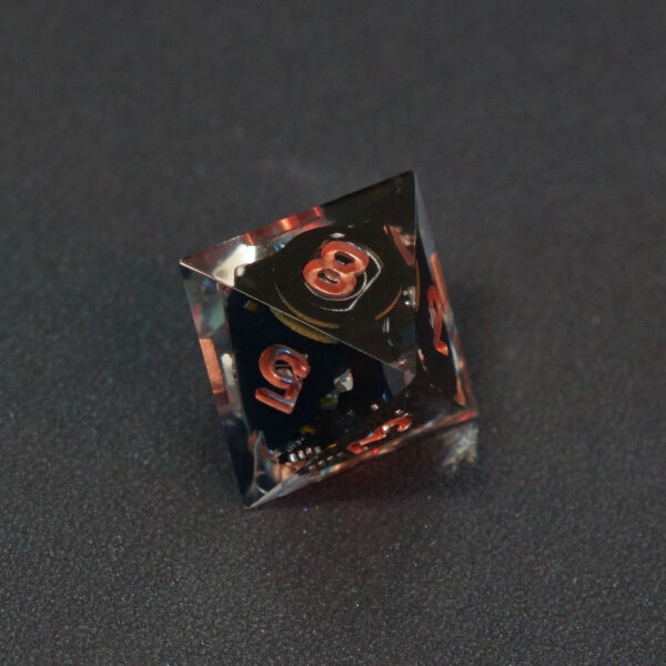 Unlit Clear D8. Clear colorway is fully transparent resin allowing internal circuit board to be visible. The numbers or symbols are painted metallic copper.