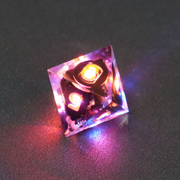 Lit Clear D8 with red and blue colors across each face. Clear colorway is fully transparent resin allowing internal circuit board to be visible. The numbers or symbols are painted metallic copper.