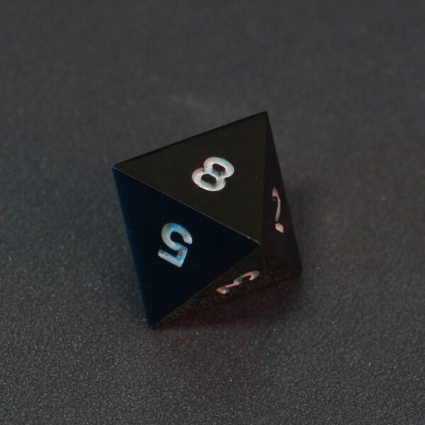 Unlit Onyx Black D8. Onyx Black colorway is a fully opaque black resin with no glitter. The numbers or symbols are painted pale white.