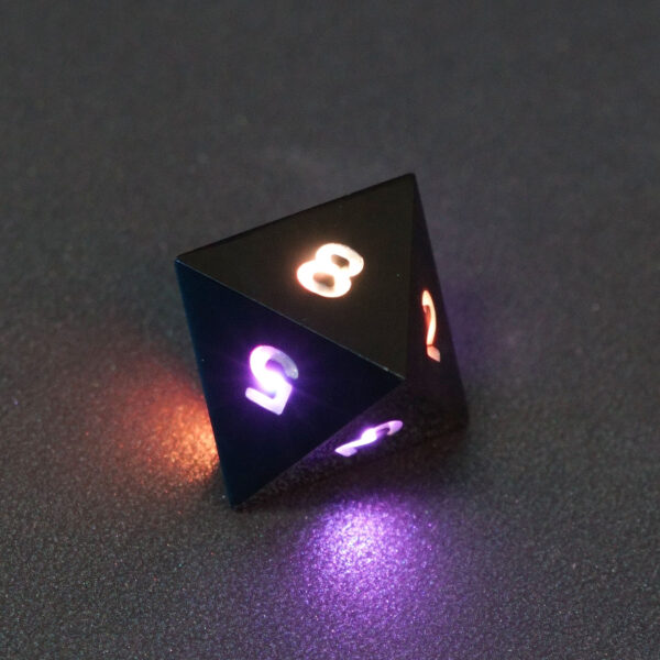 Lit Onyx Black D8 with a rainbow of colors across each face. Onyx Black colorway is a fully opaque black resin with no glitter. The numbers or symbols are painted pale white.