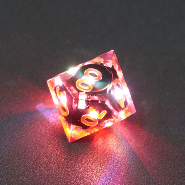 Lit Clear D00 with red colors across each face. Clear colorway is fully transparent resin allowing internal circuit board to be visible. The numbers or symbols are painted metallic copper.