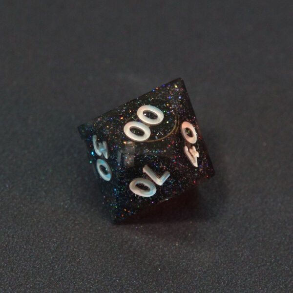 Unlit Midnight Galaxy D00. Midnight Galaxy colorway is a mostly translucent dark smoke black resin base packed with rainbow glitter of various sizes. The numbers or symbols are painted pearl white.