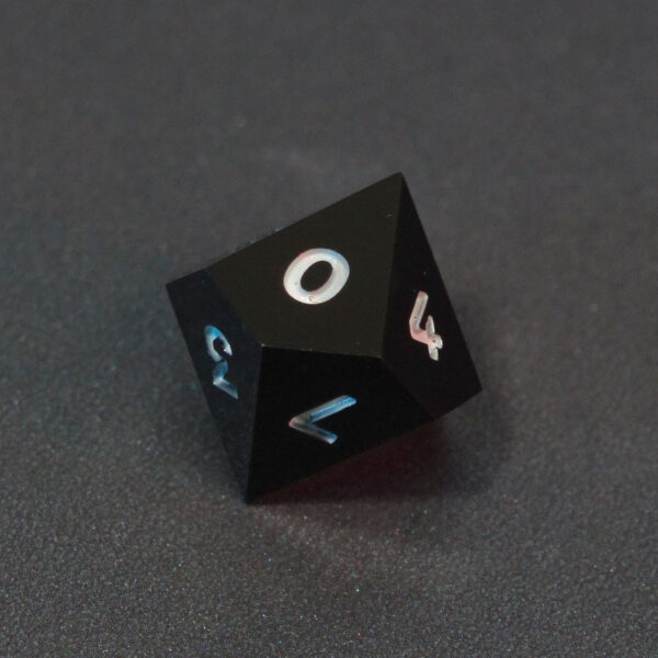 Unlit Onyx Black D10. Onyx Black colorway is a fully opaque black resin with no glitter. The numbers or symbols are painted pale white.