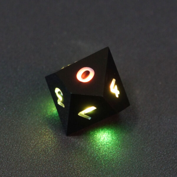 Lit Onyx Black D10 with a rainbow of colors across each face. Onyx Black colorway is a fully opaque black resin with no glitter. The numbers or symbols are painted pale white.