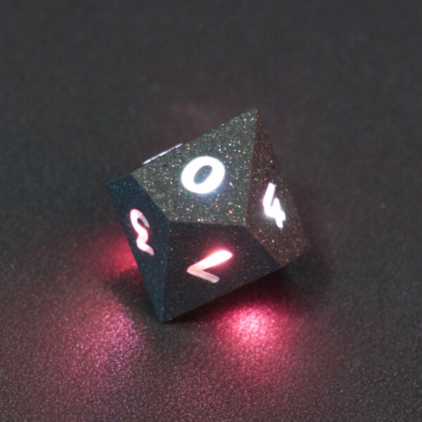 Lit Hematite Grey D10 with red colors across each face. Hematite Grey colorway is a fully opaque medium tone silver resin packed with rainbow glitter of various sizes. The numbers or symbols are painted pale white.