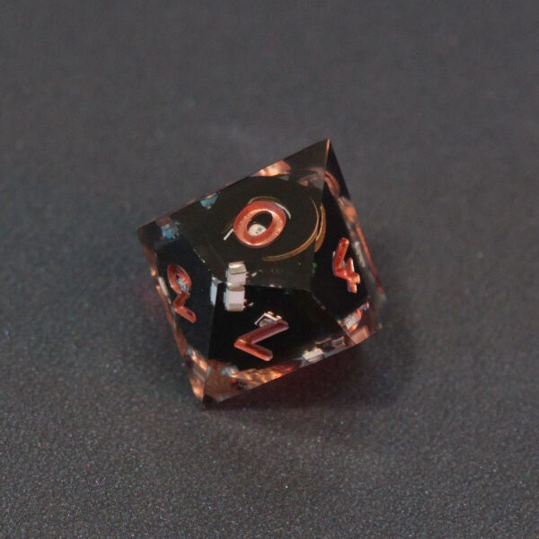 Unlit Clear D10. Clear colorway is fully transparent resin allowing internal circuit board to be visible. The numbers or symbols are painted metallic copper.