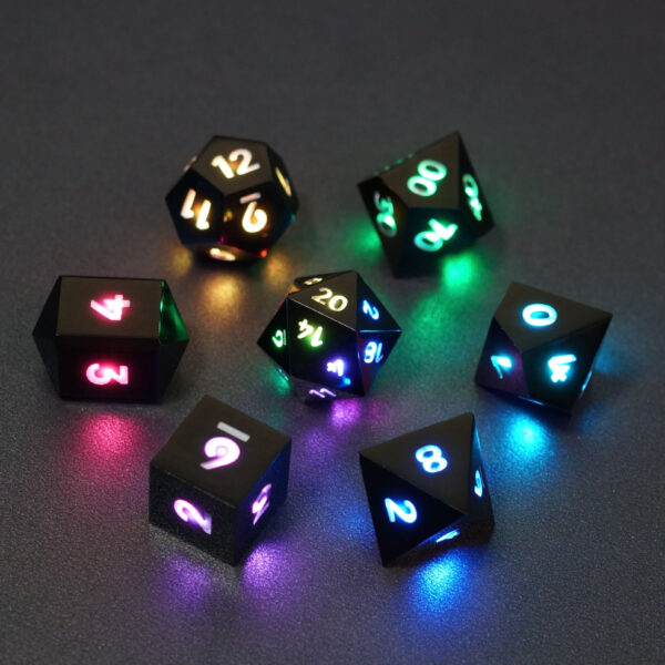 Set of 7 lit Onyx Black dice with a rainbow of colors across all faces. Set Includes: 1 D20, 1 D12, 1 D00, 1 D10, 1 D8, 1 D6, 1 D4. Onyx Black colorway is a fully opaque black resin with no glitter. The numbers or symbols are painted pale white.