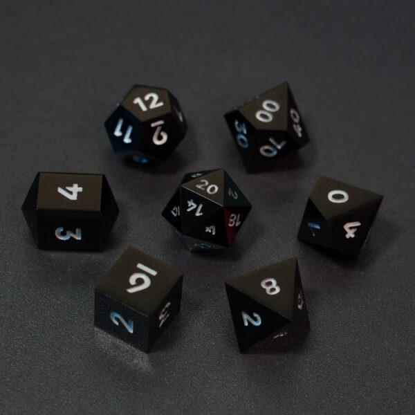 Set of 7 unlit Onyx Black dice. Set Includes: 1 D20, 1 D12, 1 D00, 1 D10, 1 D8, 1 D6, 1 D4. Onyx Black colorway is a fully opaque black resin with no glitter. The numbers or symbols are painted pale white.
