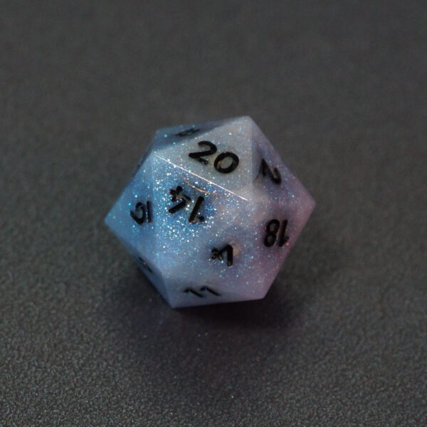 Unlit Aurora Sky D20. Aurora Sky colorway is a mostly translucent white resin base packed with small blue and silver glitter throughout. The numbers or symbols are painted metallic black.