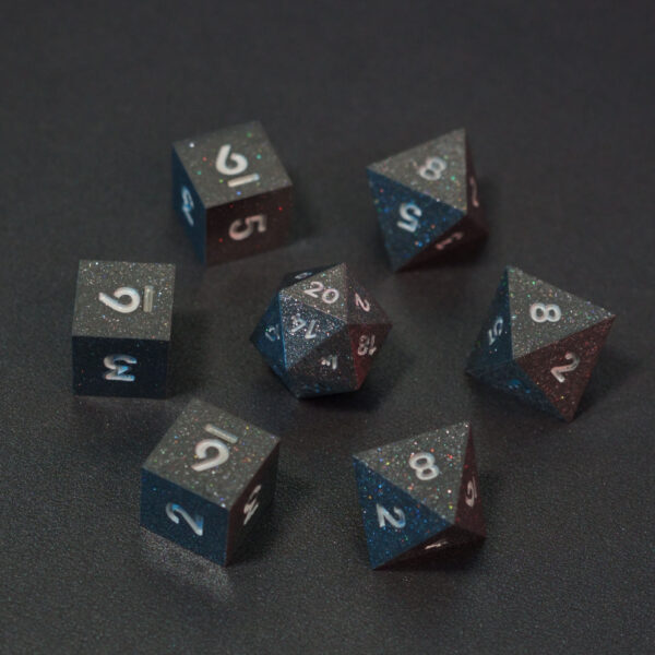 Set of 7 unlit Hematite Grey dice. Set Includes: 1 D20, 3 D8, 3 D6. Hematite Grey colorway is a fully opaque medium tone silver resin packed with rainbow glitter of various sizes. The numbers or symbols are painted pale white.