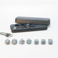 Unlit Hematite Grey Board Gamer set lined up in front of a Large Charging Case and USB Cable.
