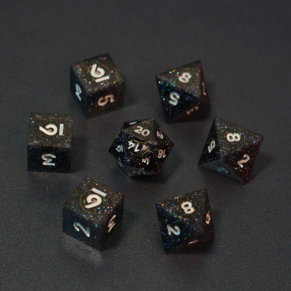 Set of 7 unlit Midnight Galaxy dice. Set Includes: 1 D20, 3 D8, 3 D6. Midnight Galaxy colorway is a mostly translucent dark smoke black resin base packed with rainbow glitter of various sizes. The numbers or symbols are painted pearl white.