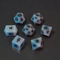 Set of 7 unlit Aurora Sky dice. Set Includes: 2 D20, 1 D12, 1 D10, 1 D8, 1 D6, 1 D4. Aurora Sky colorway is a mostly translucent white resin base packed with small blue and silver glitter throughout. The numbers or symbols are painted metallic black.