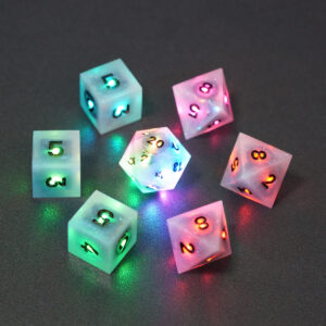 Set of 7 lit Aurora Sky dice with a rainbow of colors across all faces. Set Includes: 1 D20, 3 D8, 3 D6. Aurora Sky colorway is a mostly translucent white resin base packed with small blue and silver glitter throughout. The numbers or symbols are painted metallic black.