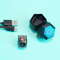 Unlit Clear D4 in a crystal shape with a Single Charger and USB cable.