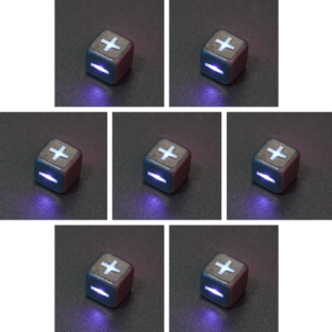 Collage of 7 lit Hematite Grey Fudge D6 with a rainbow of colors across each face. Hematite Grey colorway is a fully opaque medium tone silver resin packed with rainbow glitter of various sizes. The numbers or symbols are painted pale white.